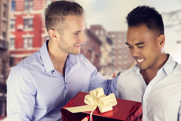 Two men gay couple exchanging a present 