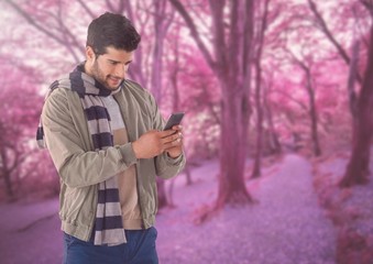 Wall Mural - Man in Autumn with phone in forest