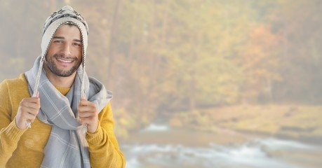 Wall Mural - Man in Autumn with hat and scarf in bright forest