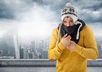 Wall Mural - Man keeping warm in hat and scarf in city