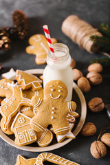 Wall Mural - Milk and cookies. Gingerbread  cookies on a gray background.  Christmas cookies.  Ginger men