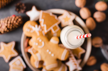 Wall Mural - Milk and cookies. Gingerbread  cookies on a gray background.  Christmas cookies.  Ginger men