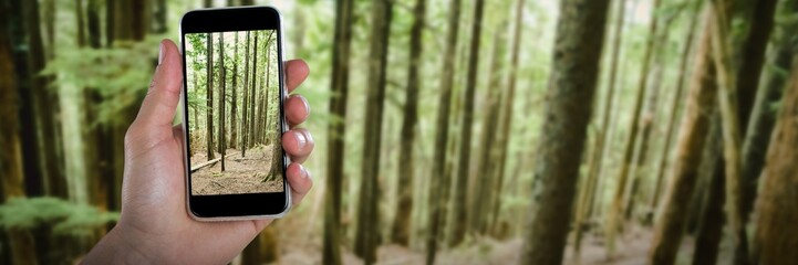 Poster - Composite image of cropped image of hand holding smart phone