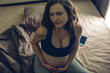© Artem - Pregnant woman feeling pain in her belly lying in bed with insomnia at night. Concept of pregnancy and health