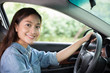 © tuiphotoengineer - Beautiful Asian woman smiling and enjoying.driving a car on road for travel