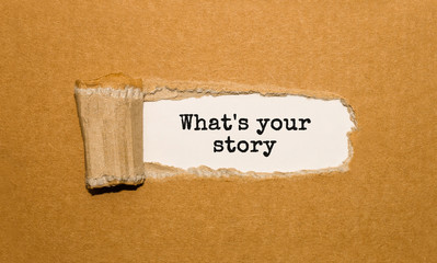 Aufkleber - The text Whats your story appearing behind torn brown paper