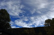 © arenysam - clouds in the sky with shadows of trees in the French Pyrenees. Occitanie in south of France
