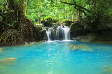  Blue lake and small waterfall. Bright exotic nature with fresh water stream.