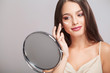 Facial Beauty. Portrait Of Sexy Young Woman With Fresh Healthy Skin Looking In Mirror Indoors. Closeup Of Beautiful Smiling Girl With Natural Makeup Touching Face. Cosmetic Concept. High Resolution