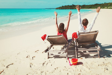 Wall Mural - Christmas on beach -chairs and happy couple at sea