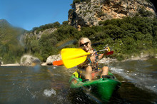 Young Girl Doing Kayak On A River