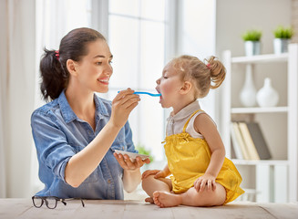 mother feeding her child