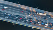 Aerial top view of bridge road automobile traffic jam of many cars from above, city transportation concept
