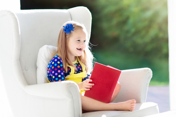 Wall Mural - Child reading book. Kids read books.