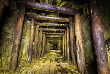 Underground Abandoned Ore Mine Shaft Tunnel Gallery Passage With Wooden Timbering