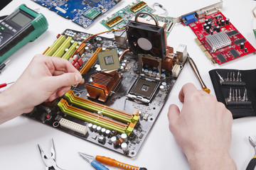 Poster - Technician plug in microprocessor to motherboard