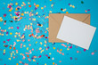 © cineberg - Blank card with colorful confetti on turquoise background