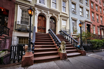 a row of colorful brownstone buildings