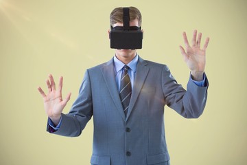 Poster - Composite image of businessman using virtual reality headset