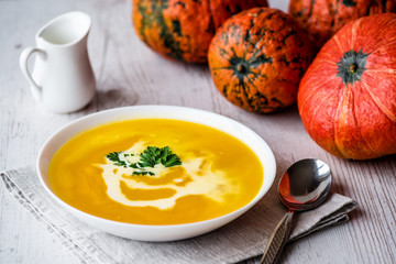 Wall Mural - Pumpkin soup with cream and parsley. Vegan food