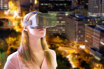 Poster - Composite image of woman using an oculus