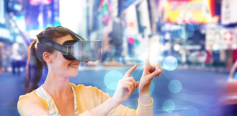 Poster - Composite image of woman using a virtual reality device