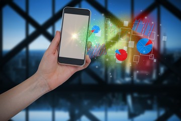 Poster - Composite image of hand holding mobile phone against large room 