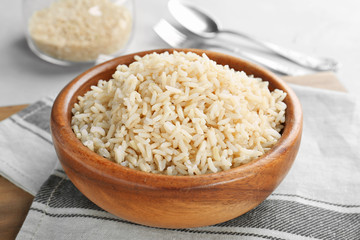 Canvas Print - Bowl with cooked rice on table