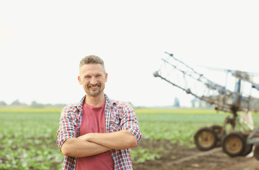 Male farmer standing in field