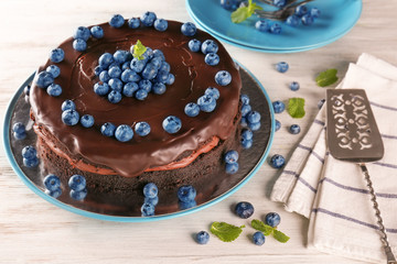 Wall Mural - Plate with chocolate cake on table