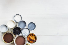 Open Cans Of Different Paints, Varnish And Stain