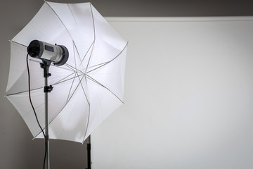 Empty photo studio with lighting equipment