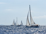 Fototapeta  - Sailing yacht in Croaatia, windy summer on the boat between rocky islands of the Mediterranean sea