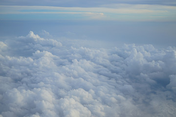 Wall Mural - shades of light blue color sky and floating white cloudscape heaven view from airplane window