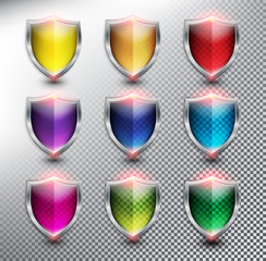 Wall Mural - Collection of 9 blank protection shields. Shield icons in 9 different colors. Transparent and isolated with realistic shine and shadow on the light background. Vector illustration. Eps10.