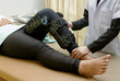© praisaeng - Physiotherapist do stretch exercises on patient's leg, rehabilitation for knee injury