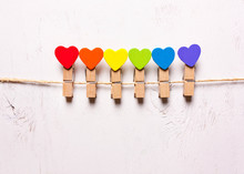 Wooden Hearts Of Rainbow Colors On Clothespins . The Symbol Of LGBT
