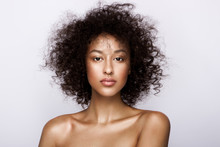 Fashion Studio Portrait Of Beautiful African American Woman With Perfect Smooth Glowing Mulatto Skin, Nude Make Up