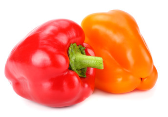 two red and yellow sweet bell peppers isolated on white background