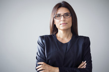 Portrait Of Businesswoman On Grey Background