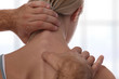 Chiropractic back adjustment. Osteopathy, Acupressure, Sport Injury Rehabilitation concept. Female patient suffering from back pain and physical therapist