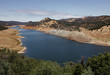 © Lucas Saugen Photography/Stocksy - An extremely low reservoir suffering from a drought.