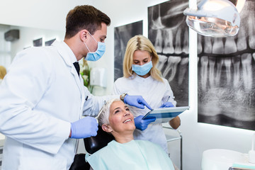 Beautiful senior woman receiving a dental treatment.