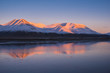 Landscape of a nature of a pink sunset in the reflection ocean mountains of Spitsbergen Svalbard near the Norwegian city Longyearbyen
