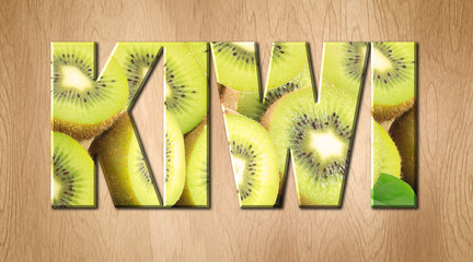 Wall Mural - Kiwi word covered with Kiwi fruit on a wooden kitchen cutting board