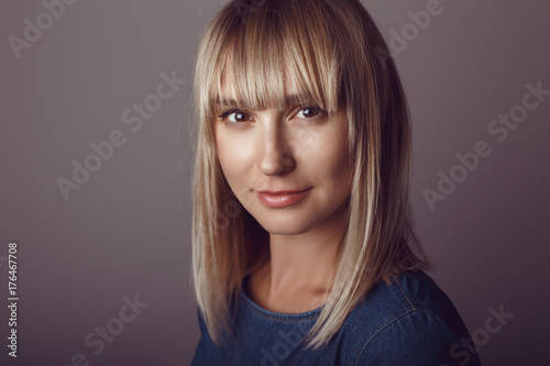 Cuadros en Lienzo Closeup portrait of beautiful young middle age blonde Caucasian woman looking in camera