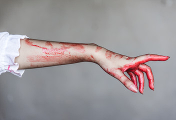 Fototapeta ghost woman or zombie stretching bloody hands