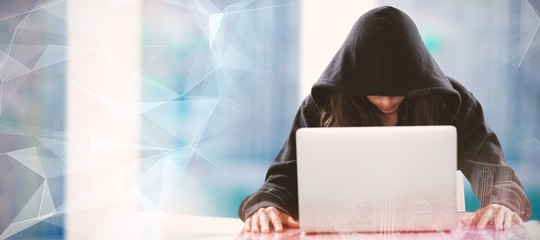 Poster - Composite image of female hacker sitting by laptop on table 