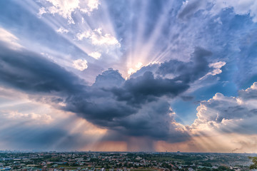 Landscape afternoon in a small town with sun rays through the clouds seen from above as beautiful paintings