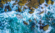 Drone View Of Waves Hitting Sea Shore And Rocks